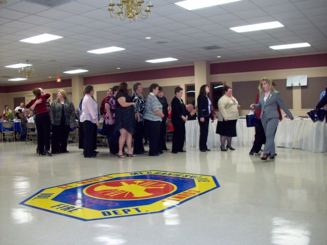 Chief Craig hands out bags to the Ladies Auxiliary members in appreciation for their hard work in 2007.